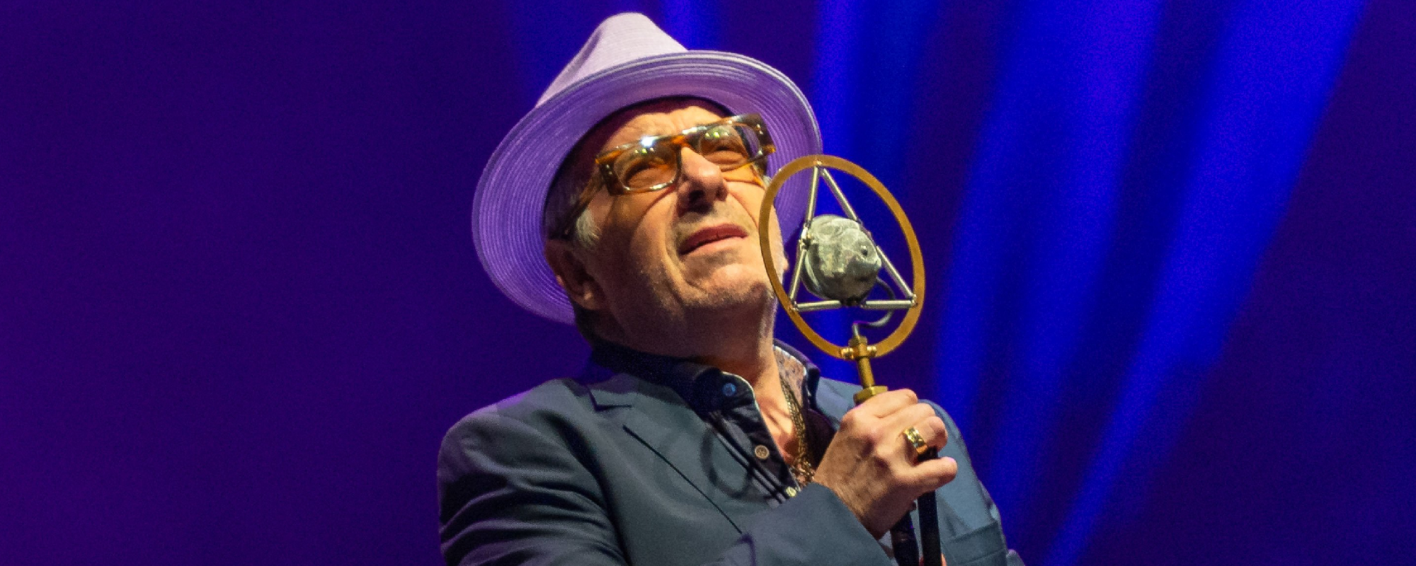 Elvis Costello Continues To Perform Even After Two Bandmates Became Ill