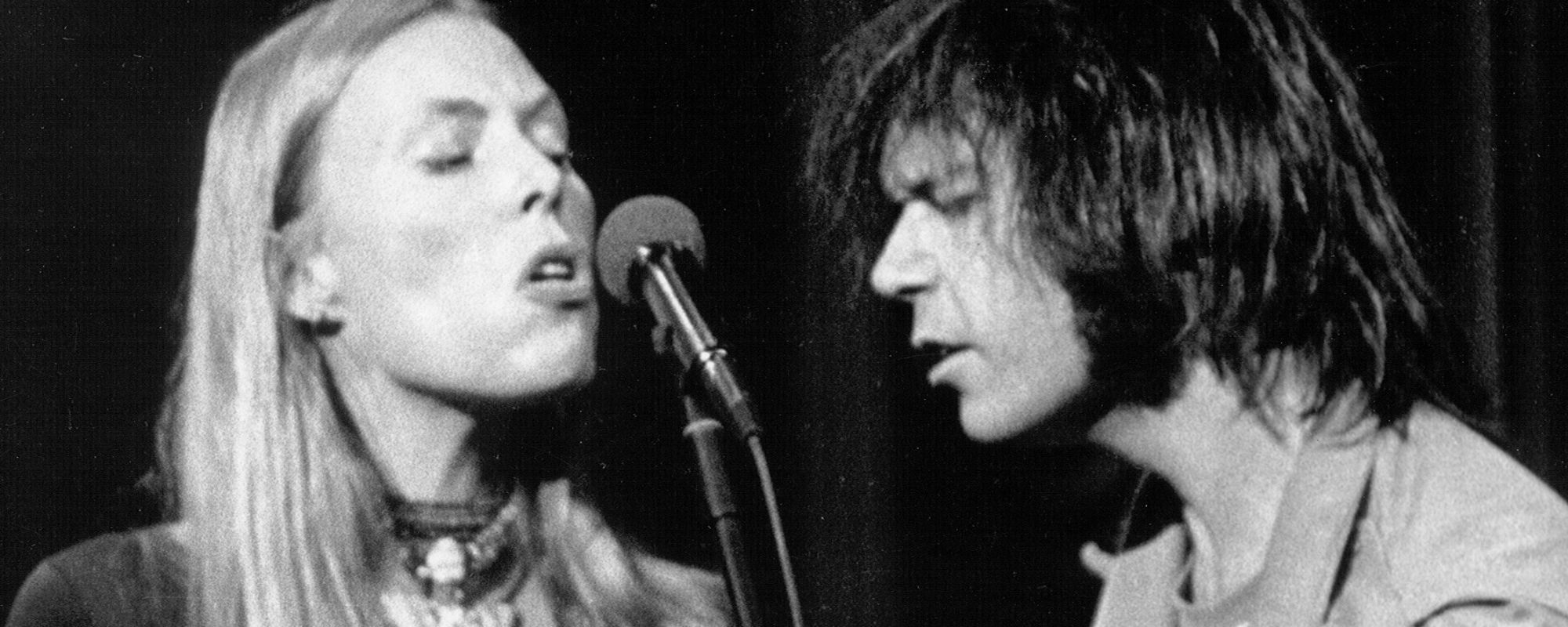 Joni Mitchell and Neil Young performing