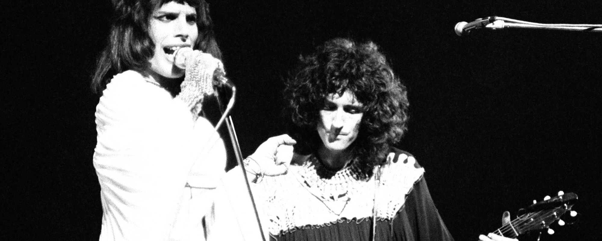 Freddie Mercury and Brian May of Queen performing